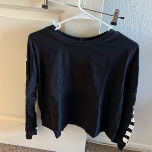 Cute black crew neck shirt with checkered arms